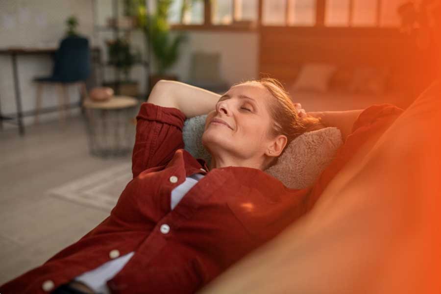Customer relaxing in a comfortably heated home
